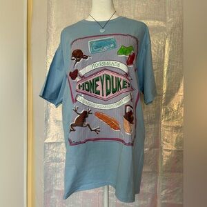 Warner Bros. Honeydukes Graphic Tee in Light Blue with Pink and Green Accents